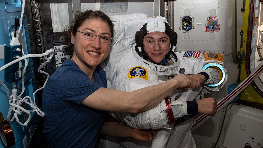 Space_Station's tweet photo. .@Astro_Christina and @Astro_Jessica switched their spacesuits to battery power this morning at 7:38am ET beginning the first #AllWomanSpacewalk. Read more... https://t.co/Og6wqhTOR1 https://t.co/Sl4XeI0dIR