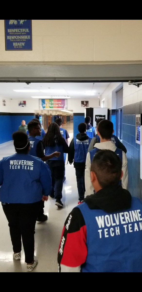 Wolverine Tech Team heading out to work in the school.