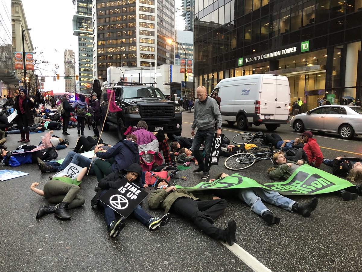 luisaalvarez95's tweet photo. Protesters have stopped on #GeorgiaSt to stage the “die in” representing what they say will happen to the human race if nothing is done about #climatechange @CTVVancouver #XRVancouver #SnakeMarch https://t.co/kxdmtUkMJ5