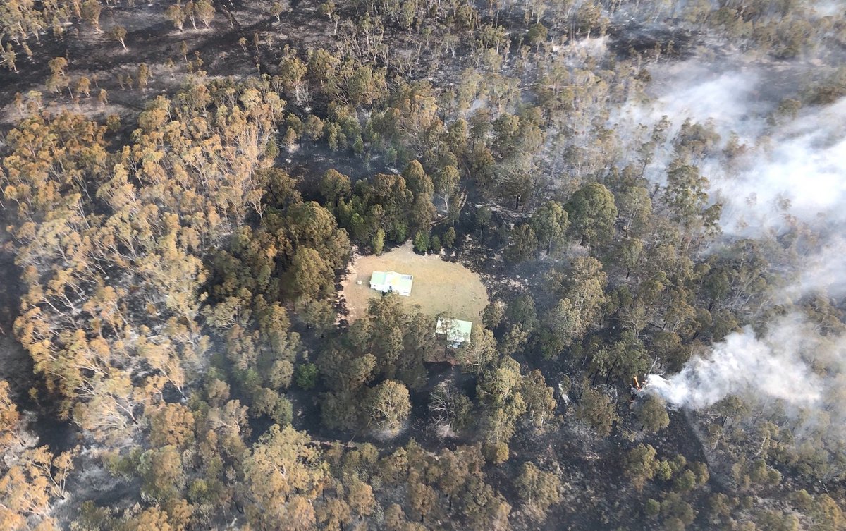 NSWRFS's tweet photo. How's this for some great saves - firefighters, landholders and aircraft working together to save these homes from the Carrai Creek fire south-east of Armidale. It shows how close the fire came to homes - and the importance of a cleared area around buildings. #nswrfs #nswfires https://t.co/DgTdivdu64