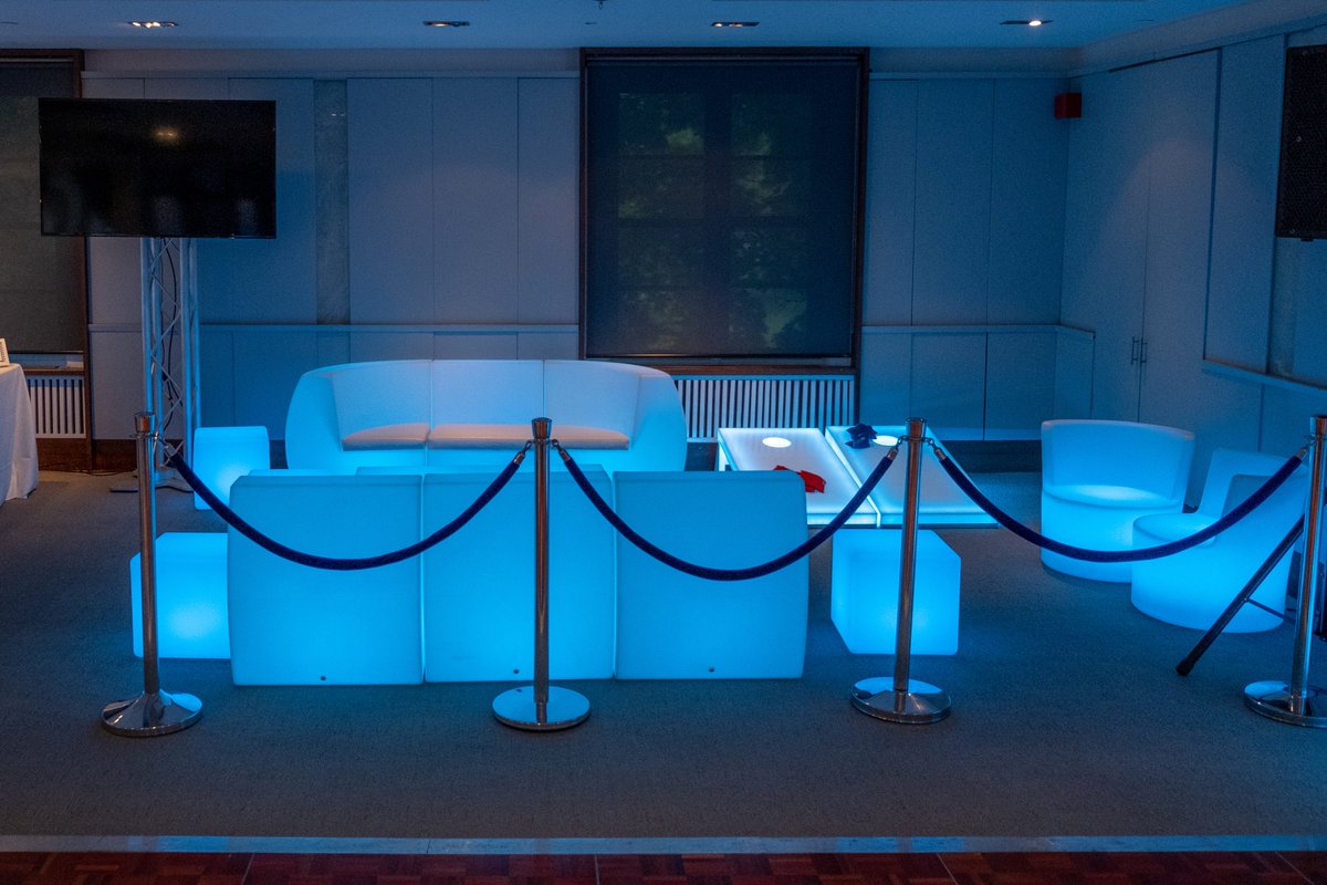 twist__events's tweet photo. A Pretty Cool Looking VIP Glow Lounge. Complete with Stanchions, Couches and Glowing Cornhole game. Photography by the talented Michael Ciurleo at mcpimages Glow Lounge Furniture by @AuraEffect  LED cornhole by AbbeyRoad Entertainment and Navy Velvet Ropes by All Cargo https://t.co/sYN736DNGs