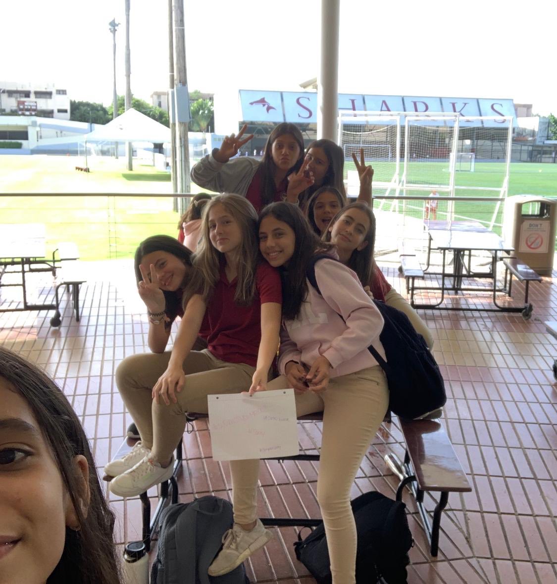 TedOCschool's tweet photo. Last week I wasn’t here for #PositiveSignThursday on Friday. So these girls made a sign and took a pic anyway! So proud! They shared with me today and today was another awesome #positivesignfriday in the DR! #cmsdigsdeep #JoyfulLeaders @casehighprinc @MGeoghegan22 @CMSSharks https://t.co/BSLgwKIwHl
