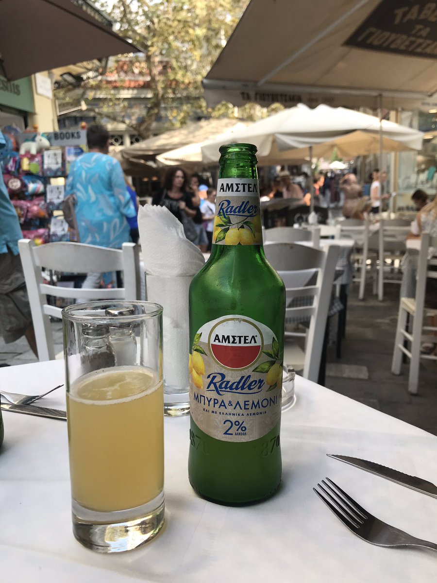 char_des's tweet photo. What better way to unwind from a heavy conference? Enjoying a radler on the plaka. #InterPride2019 https://t.co/UMKwQNFSSu
