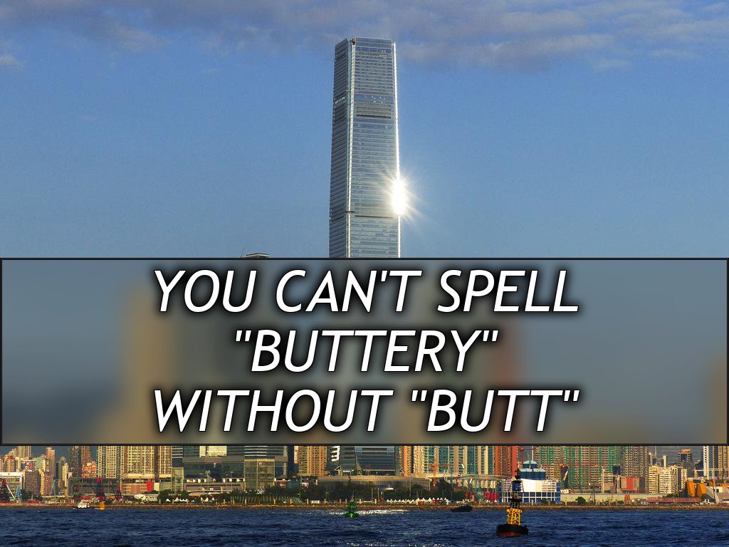 A very tall skyscraper with a bright reflection of the sun, at a water front. It's surrounded by several other shorter skycscrapers