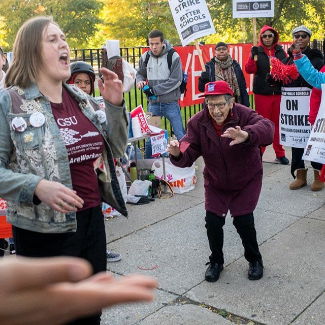 Bea Lumpkin, a 101-year-old labor activist in Chicago, joins in and dances with members of the Chicago Teacher's Union as they hit the picket lines on the first day of their strike, October 17, 2019. #ctu #ctustrike #chicago #union #laborunion #teachers #school #labor