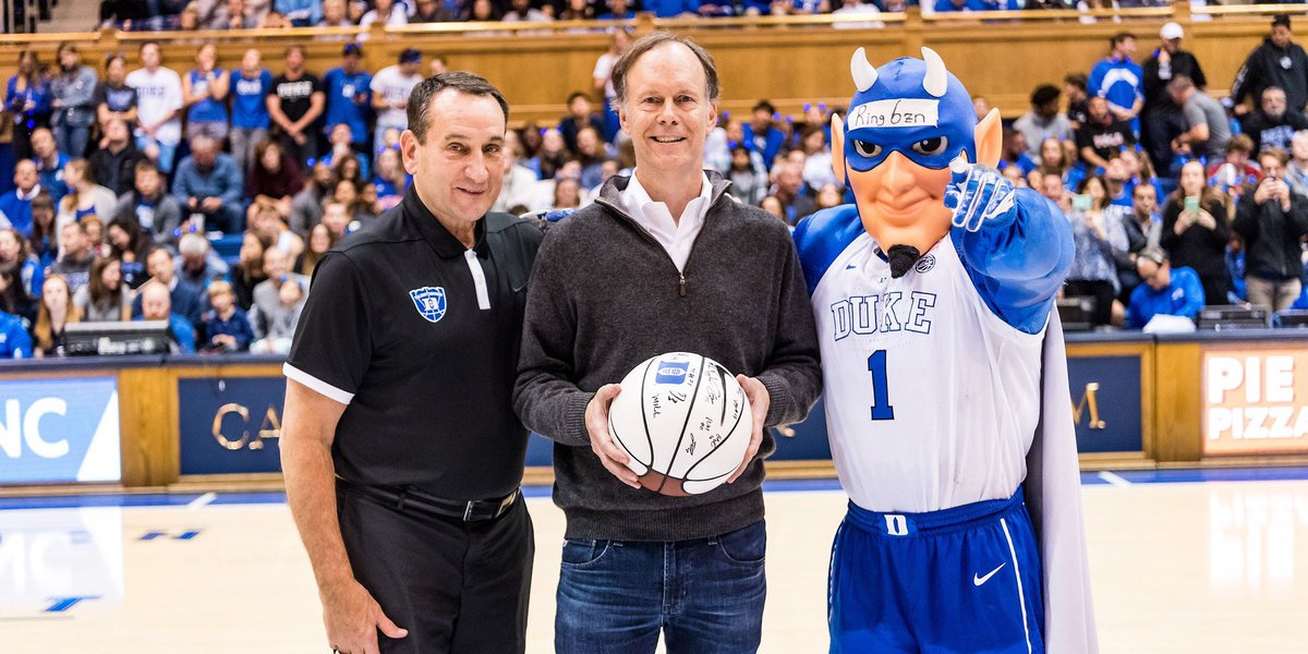 Coach K, William G. Kaelin Jr., and the Blue Devil in Cameron Indoor Stadium.