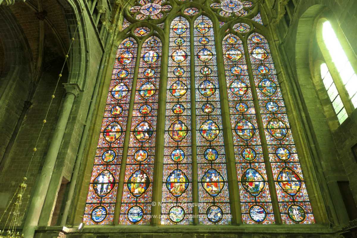 3/  #Dinant  #Belgium - lovely 12th C  #NotreDame de Dinant cathedral sits on site of older 10th century Romanesque church destroyed by boulders falling from adjacent cliff. Voila the beautiful south stain glass window, supposedly the world's largest!