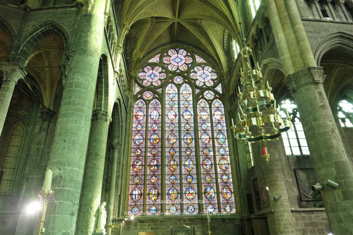 3/  #Dinant  #Belgium - lovely 12th C  #NotreDame de Dinant cathedral sits on site of older 10th century Romanesque church destroyed by boulders falling from adjacent cliff. Voila the beautiful south stain glass window, supposedly the world's largest!