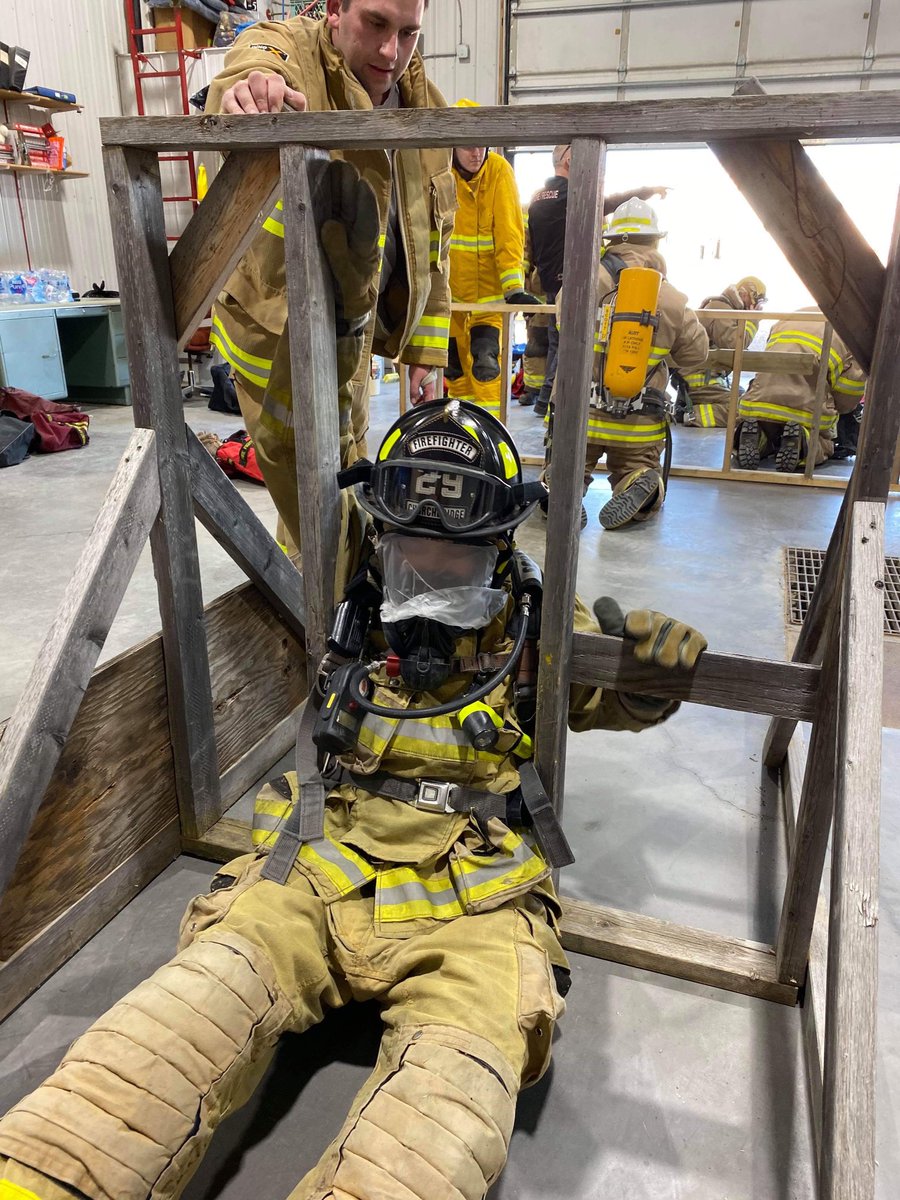 CBFireRescue's tweet photo. Firefighter Kaminski crawls through a training prop wall during the SCBA course at the #SVFFA training weekend. #firefighter #neverstoptraining https://t.co/Z2h20T9iJJ