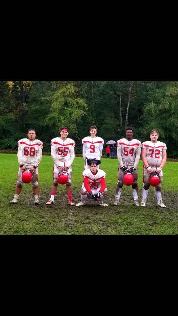 STMCoachPower's tweet photo. Squeaky clean looking QB with his muddy OL. After a hard fought @stmcfootball win! @BCHSFB @STMCBurnaby https://t.co/SA6iG8UvnV