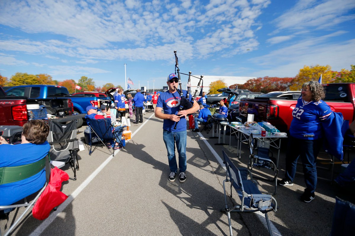MQMulville's tweet photo. Jeremy Button plays the bagpipes as he walks through the parking lot as Bills fans enjoy the beautiful weather before the game with the Dolphins at New Era Field in Orchard Park Sunday, October 20, 2019.    (Mark Mulville/Buffalo News) #MIAvBUF https://t.co/ppCjVMt2z3
