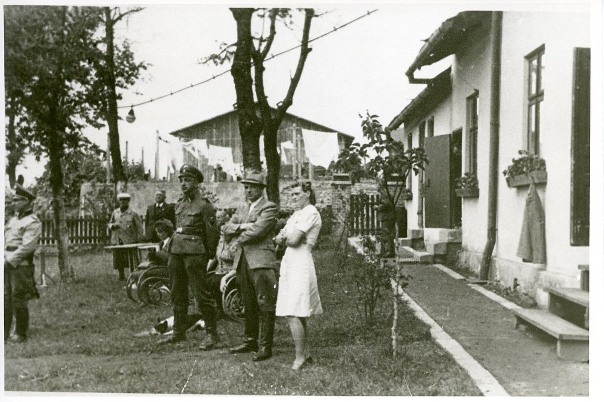 Photo 2(They were provided by Hugo Bleines- in fedora, sports coat, and high boots- as part of a post-war trial.)