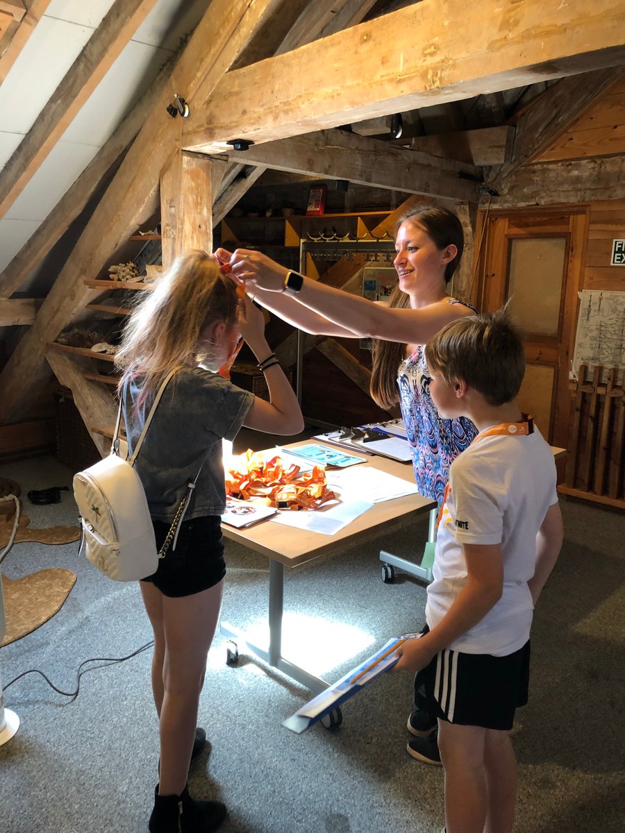 A family being given their VIP lanyards.