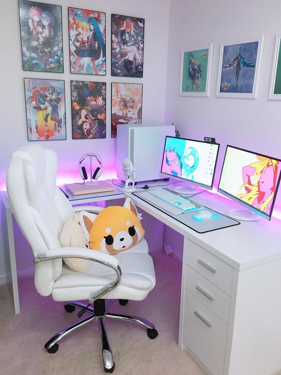 Anime girl working at her desk. Cute drawing of a young woman sitting at  her computer.