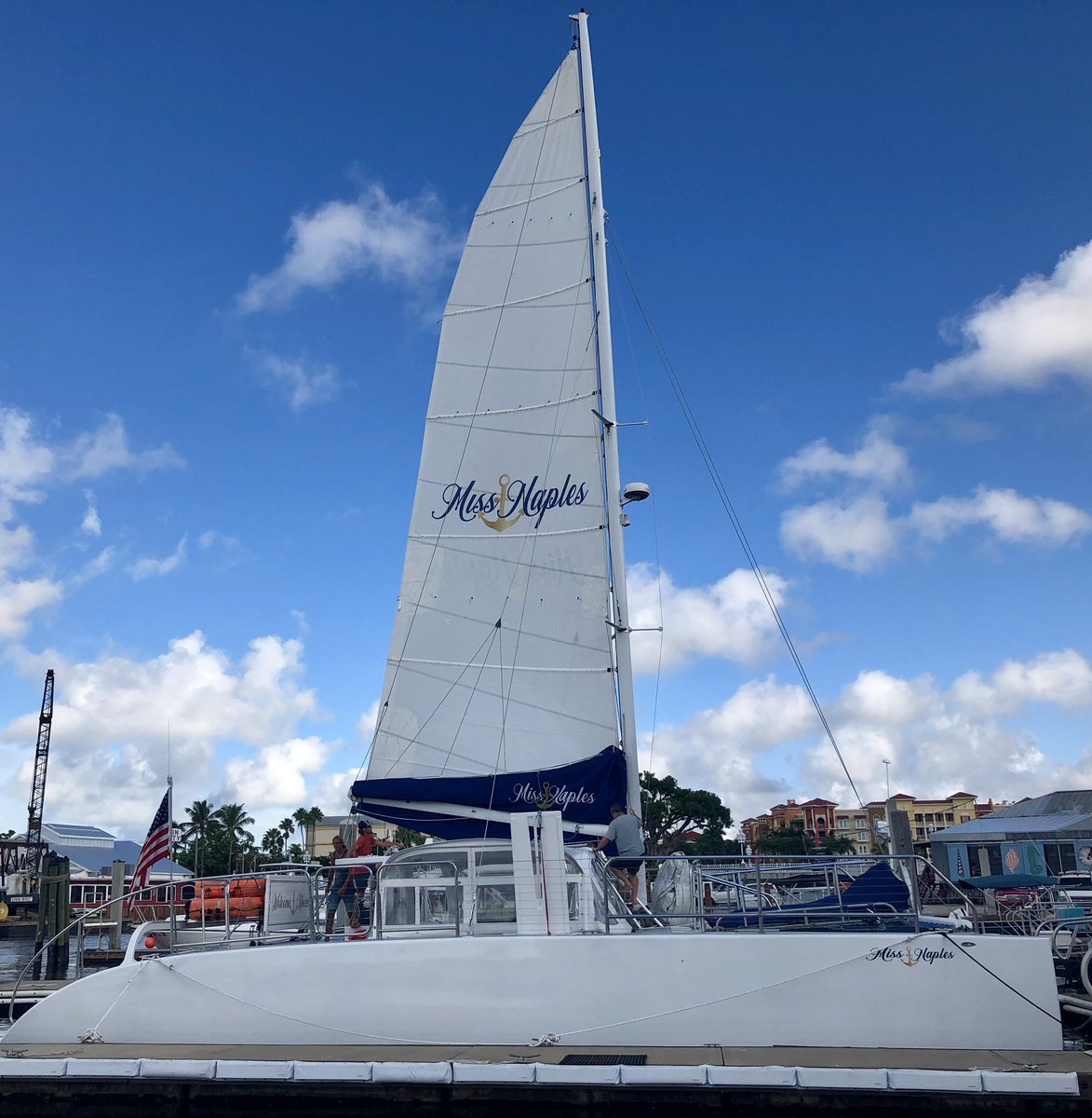 Putting our new custom sail on! Doesn’t she look pretty?! #sailing