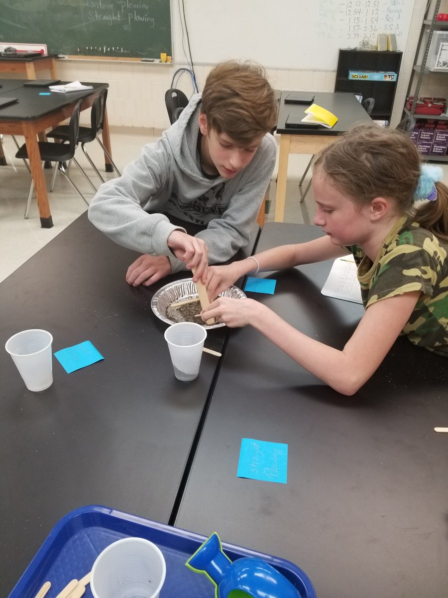 MrsATower's tweet image. Students in my 2nd hour class creating models of fields using contour plowing, terracing, and straight plowing to see the most effective method to conserve soil. #7twolves7pride
