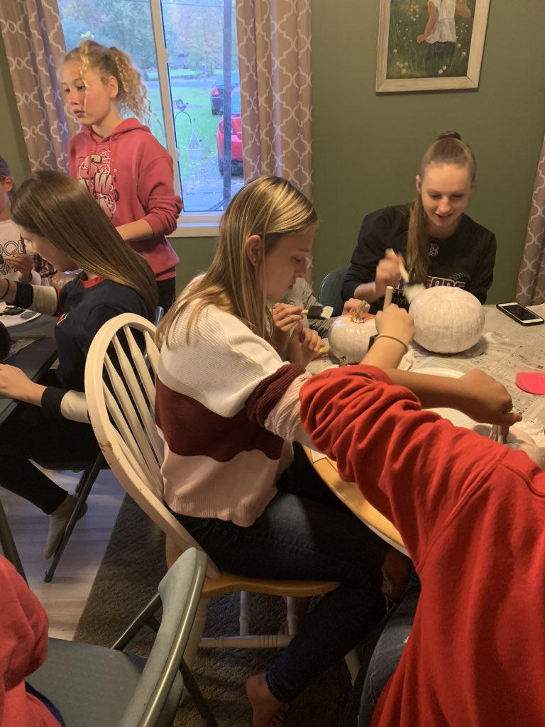 Bryan_Cheer's tweet photo. JH and HS team bonding. 👯‍♀️ Lots of food. 🌭🍫 Lots of chatting and laughing. 🗣😂 Now painting pumpkins. 🎨🎃 This is what coaching a group of great girls is all about! 💜💛📣 https://t.co/pVsYQr4FuX