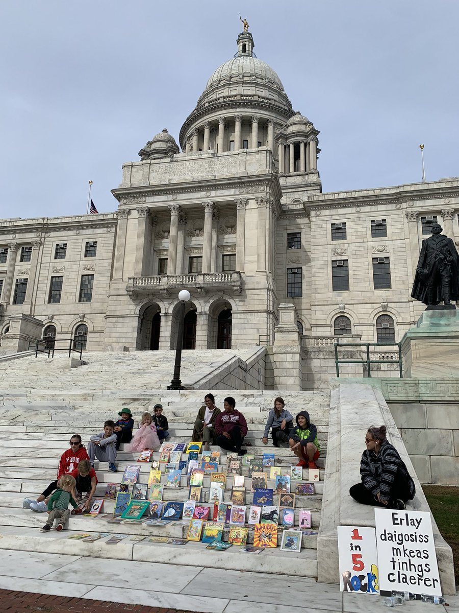MsKurto's tweet photo. All of my children attended @DecodDyslexiaRI’s “Until All Kids Can Read” #readingequity rally where we explained the #scienceofreading to parents, educators, preservice teachers & @nbc10.My eldest held some visuals while clearly, you can see how my youngest feels about #politics! https://t.co/x52IKjBNZG