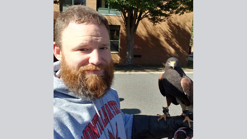 Holding a Harris’s Hawk at #RedhawkHomecoming at @montclairstateu. Apparently, he is quite the poser. #ModelOfTheDay 

#Congrats to @Montclair_FB for the win, and #250 for Coach Giancola! 

#Homecoming2019 @MontclairAlumni @NCAAFootball #D3Football #redhawkpride #redhawk4life