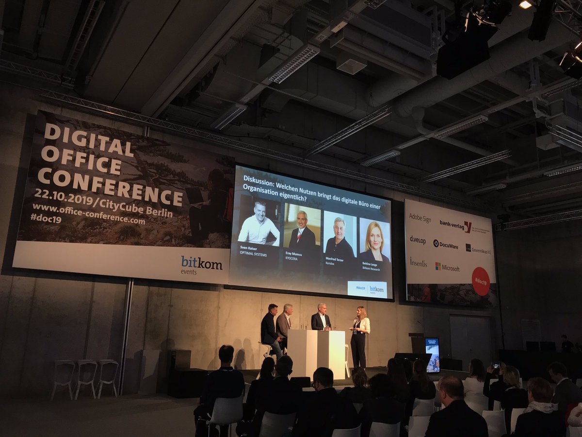 BitkomResearch's tweet photo. Welchen Nutzen bringt das digitale Büro einer Organisation eigentlich? Darüber spricht Bettina Lange @BitkomResearch mit Sven Kaiser @OptimalSystems, Eray Mumcu @kyocerade, und Manfred Terzer @prodbykendox auf der @SmartCountryCon #doc19 https://t.co/kEHzrH2TnQ