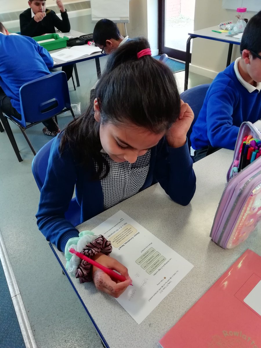 Rowlatts_TMET's tweet photo. Year 5 are working hard at division problem-solving! #rhmaths #resilience #reciprocity https://t.co/COnCQI1sj5