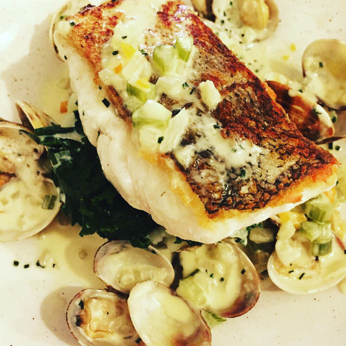 Pan roasted Hake, clams, kale, crushed new potatoes on the Pub menu, food is served all day everyday  12-9pm #GoodFood #Fresh #seasonal #GastroPub #Wiltshire #LogFires #Delicious @top50gastropubs @aahospitality @michelinguide @wiltshirelifemag