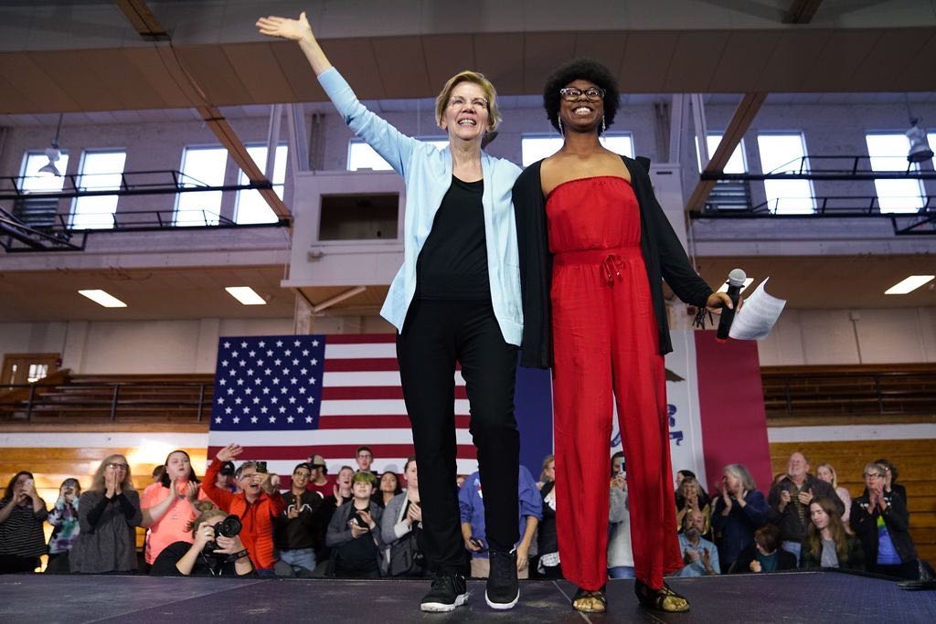 Elizabeth Warren waves to a crowd of supporters in Cedar Falls, Iowa.