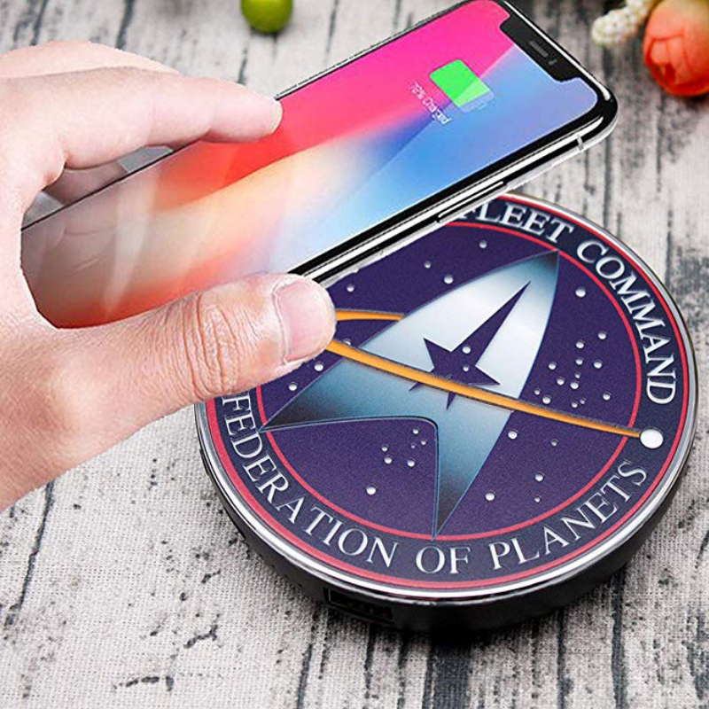 fametek's tweet photo. It might not beam you up, but the Star Trek Starfleet Command wireless charger is 10% off with code FAMETK10 for a limited time! Energize your phone Wirelessly using the new Star Trek Qi Wireless Charger with Backup Battery and Illuminated STARFLEET COMMAND logo! https://t.co/pLATTlZUfX