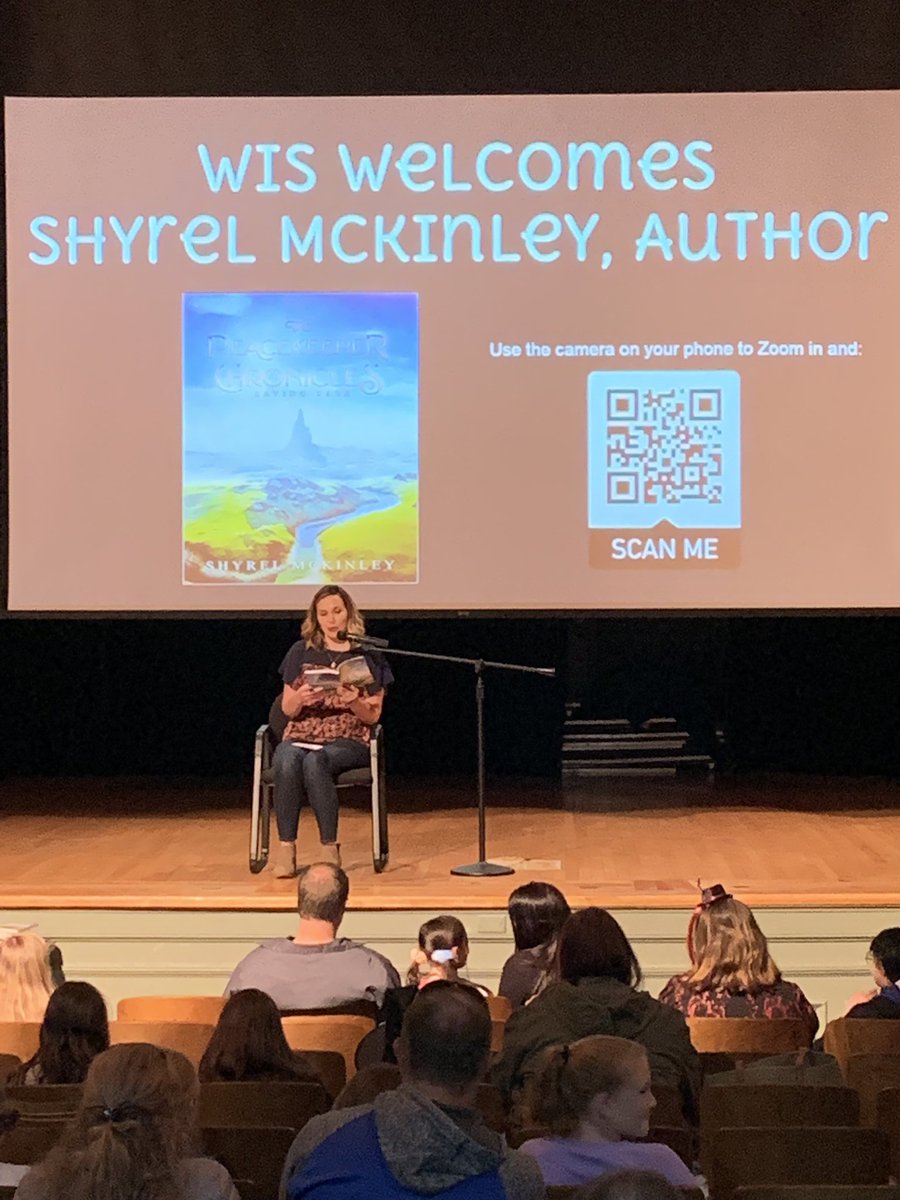Pekin author and former WIS student, Shyrel McKinley reads to students and answers questions at Family Reading Night #d108ourpurpose