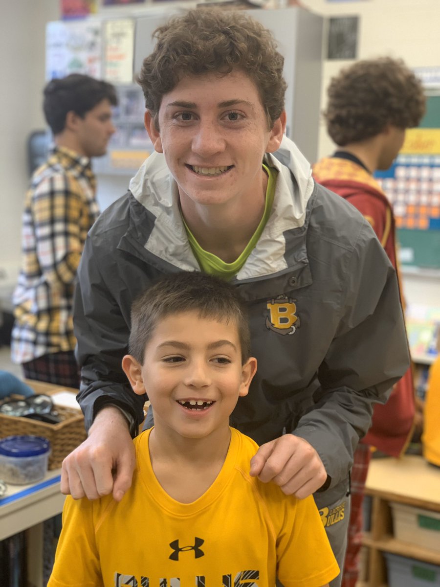 BullisSchool's tweet photo. Lower School students met their Senior buddies for the first time. It was clear the youngest bulldogs knew they were in good company. Lower and Upper School Buddies’ giant smiles brightened a grey day. #CaringChallengingCommunity #Bullis2020 #teambullis https://t.co/OKYYKE7xbv