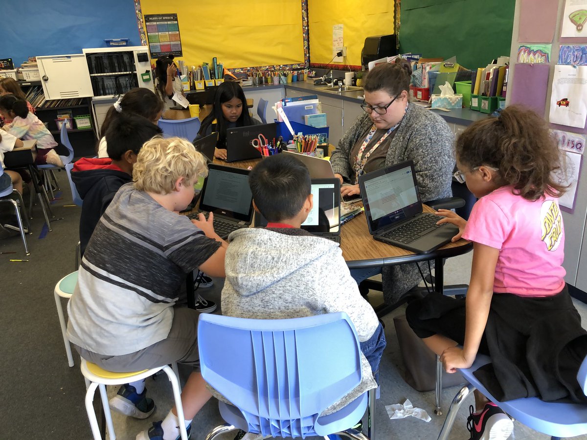 KHughesElem's tweet photo. Fourth grade students in Ms. B’s class worked in small groups on realistic fiction writing & math practice on area and perimeter today. #hugheshammerheads https://t.co/g209Fx9Blm