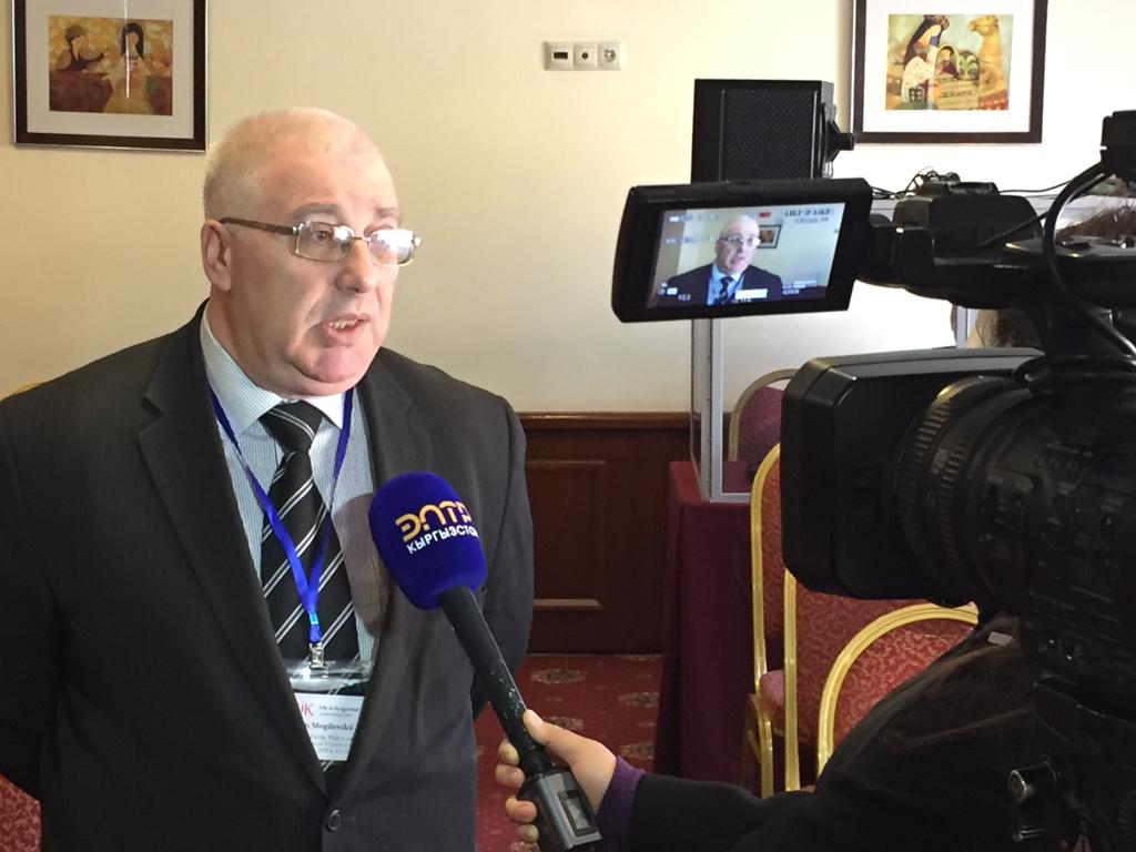 ucentralasia's tweet photo. 📽 Dr Roman Mogilevskii, Associate Director of @ucentralasia's Institute of Public Policy and Administration, is being interviewed by #ELTR TV news station at the #Life in #Kyrgyzstan conference, held in #Bishkek today and tomorrow at the @ParkHotelBishk. Stay tuned. #LIK2019 https://t.co/f2a6mxK3Z4