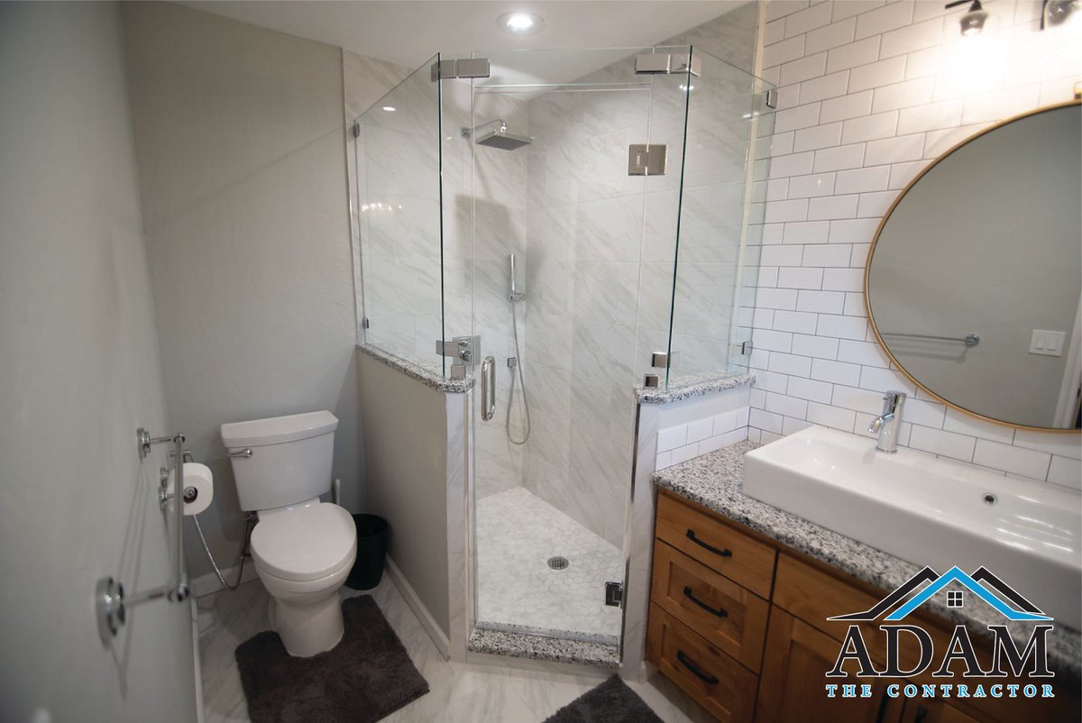 AdamContractor's tweet photo. This client wanted a rustic look with a contemporary touch. We decided together to use gray paint, white and gray shaded 12x24 tiles, chrome fixtures, a custom rustic vanity, a larger farmhouse sink and a round mirror. How do y’all think it turned out? #plano
#adamthecontractor https://t.co/IOqxpXRMk5
