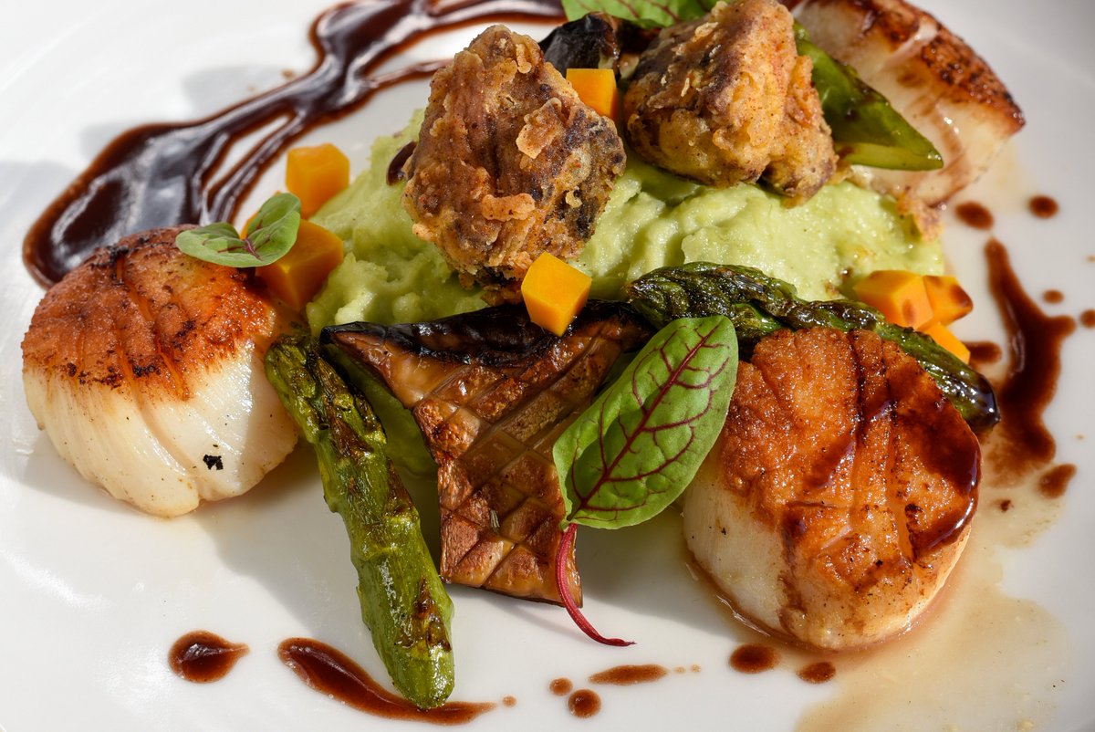 Dive into our George Banks Diver Scallops and Short Rib nuggets on mashed butter means with griddled king trumpet mushrooms, asparagus, pickled kabocha, and beurre rouge.