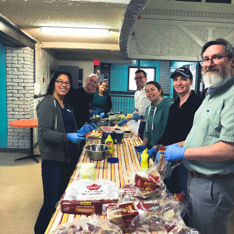 AMAcommunity's tweet photo. A group of our team members spent the morning at @mustardseedyeg making sandwiches to help give back to their community. Way to go team! #PracticallyFamily #GiveBack https://t.co/8qWLFXUOmn