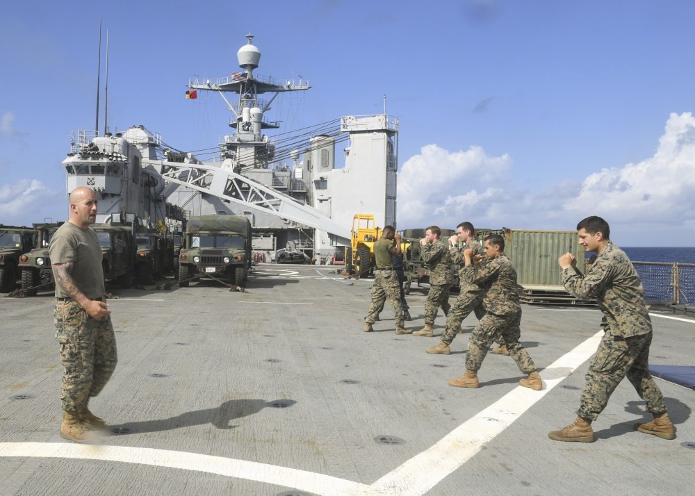 USPACOM's tweet photo. @USPacificFleet #Sailors and @PacificMarines participate in Marine Corps Martial Arts Program #MCMAP onboard USS Germantown #LSD42. #ForgedByTheSea #SemperFi #Lethality #CTF76 #AmphibiousSquadron11 #FreeandOpenIndoPacific https://t.co/VZQSpeeAwB