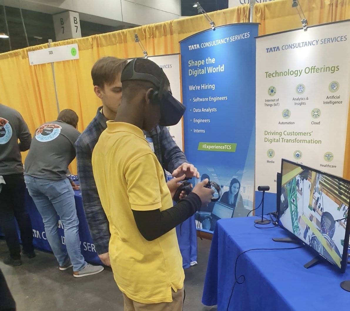 tcs_na's tweet photo. .@CincyChamber’s The Big College Event was a home run with a visit from Mr. Redlegs. If you love #technology like #VR and drones and you couldn’t connect (four) at our booth, then apply for our jobs online anytime at: https://t.co/oVtFoGRf4o #TBCE #ExperienceTCS https://t.co/vWJQIs4weM