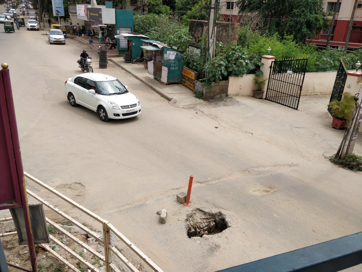 Sinkhole right outside Govindam Apartments near spice garden skywalk.  It's been there for a year or more. Matter of time before someone gets seriously injured.@WFRising @BBMPCOMM @ArvindLBJP @pothole_raja @citizensforblr #bangaloreroads #mahadevpurademands