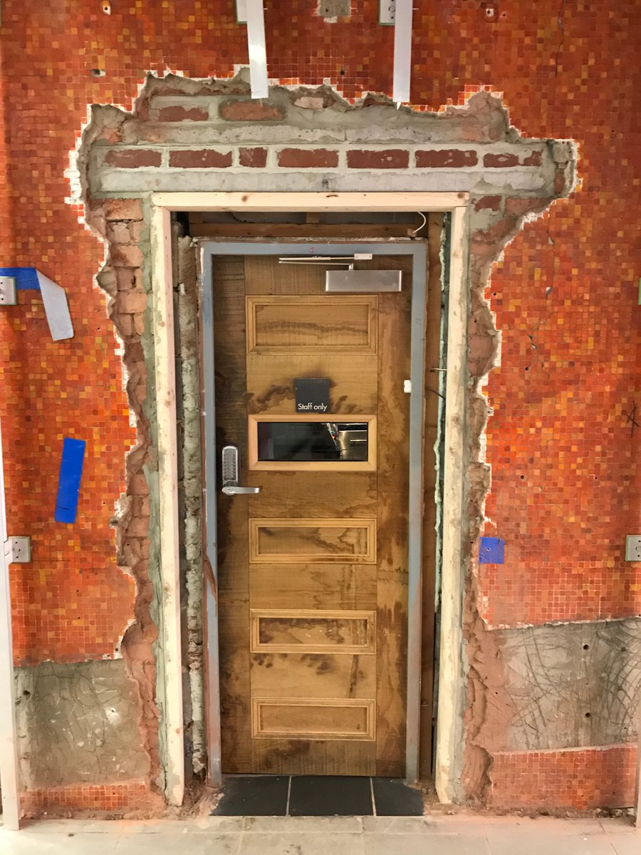 WattsLeeds's tweet photo. #SurveyorsEyeView: The redevelopment #project at #Leeds station is peeling back layers to reveal old designs – check out the #pumpkin orange tiles! We also like the vision panel adaptation to the old door #PeekABoo https://t.co/bBQ9ljAiic