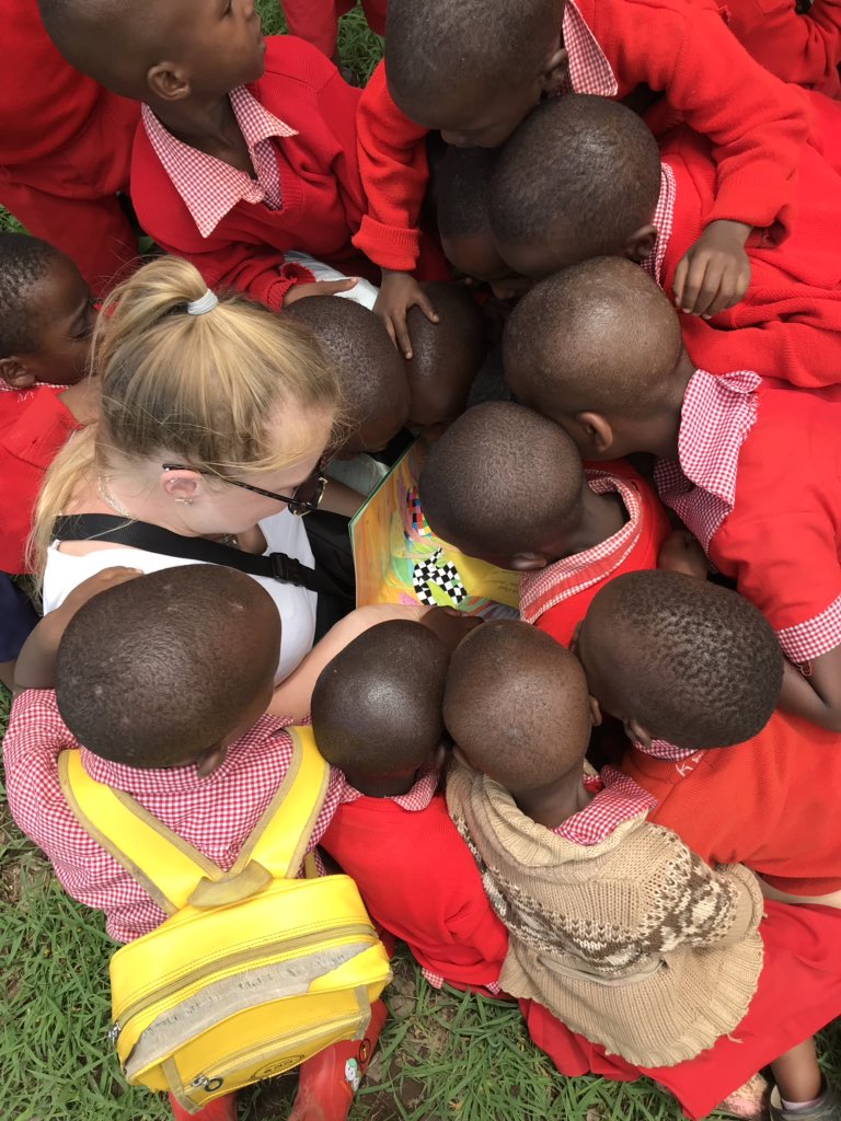 Miss Evans and Elmer the Elephant recruiting new book lovers at KYGN School in Tanzania <a href="/LibSHS/">SHS Library</a> <a href="/SurbitonHigh/">Surbiton High School</a>