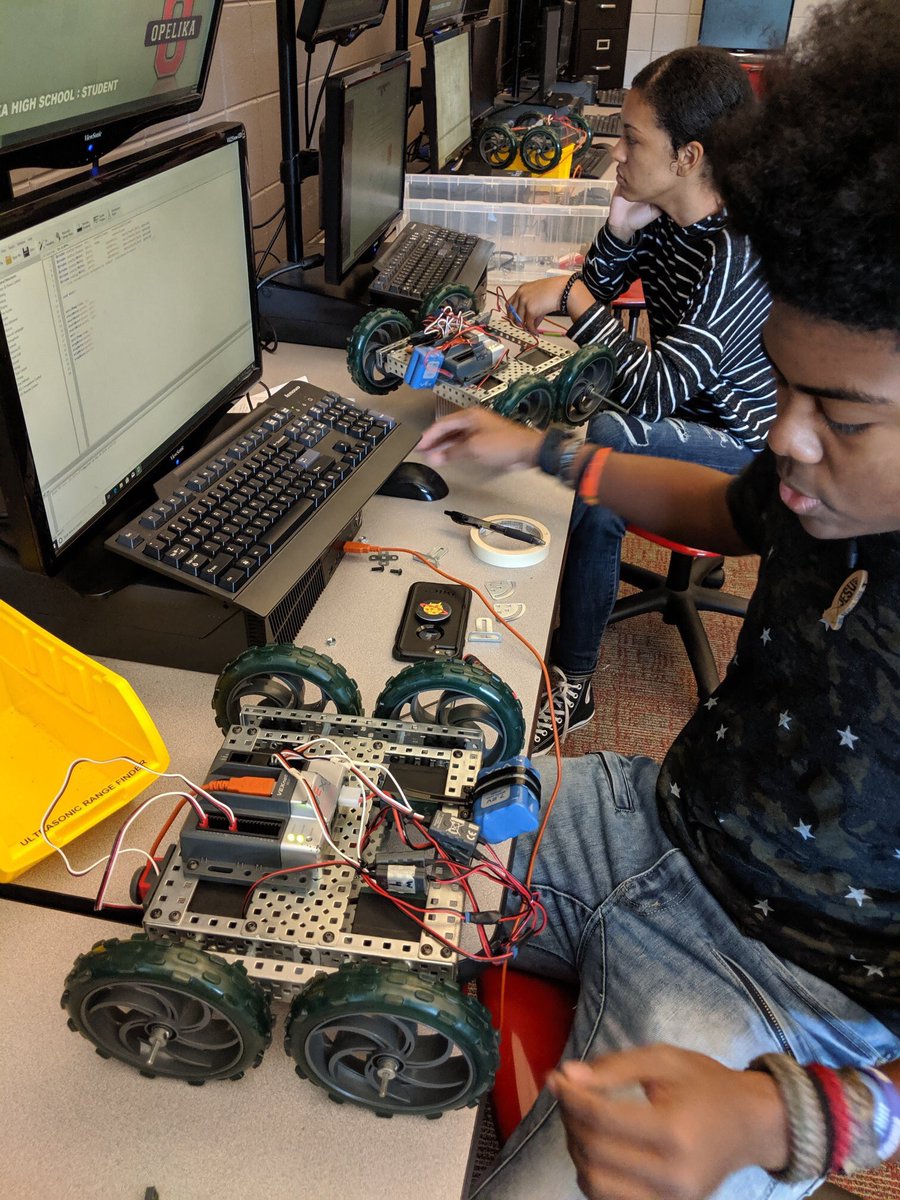 OpelikaCTE's tweet image. Students in Computer Integrated Manufacturing have learned to program in RobotC and are studying the use of Automated Guided Vehicles in manufacturing. They have built small robots and are composing and testing their code to see if it can accomplish a task without a human driver.