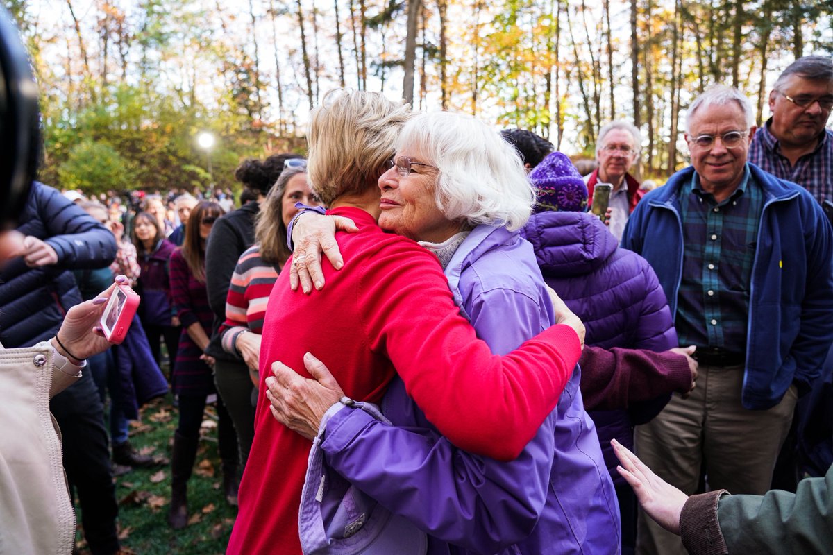 Elizabeth Warren hugs a woman at the Dartmouth College Town Hall. 