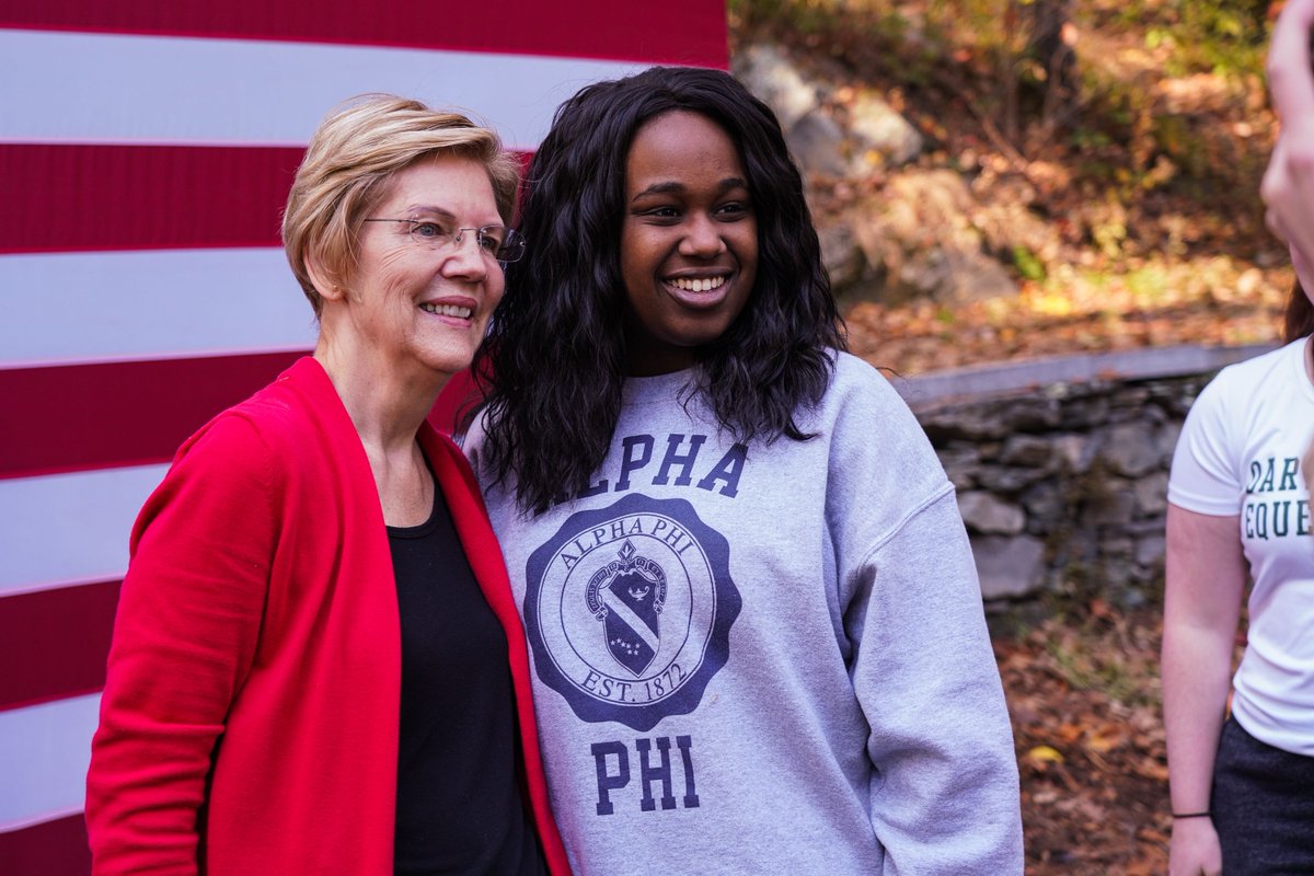 Elizabeth Warren takes a photo with a woman at the Dartmouth College Town Hall.