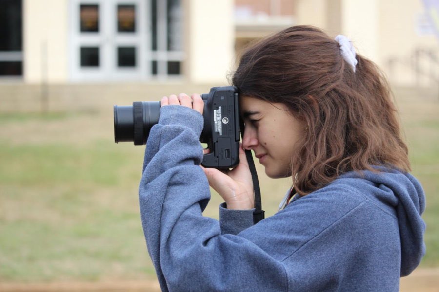 Photo of the Week! Alicia Sowell captures the essence of her next photo as she readies herself and her camera.
