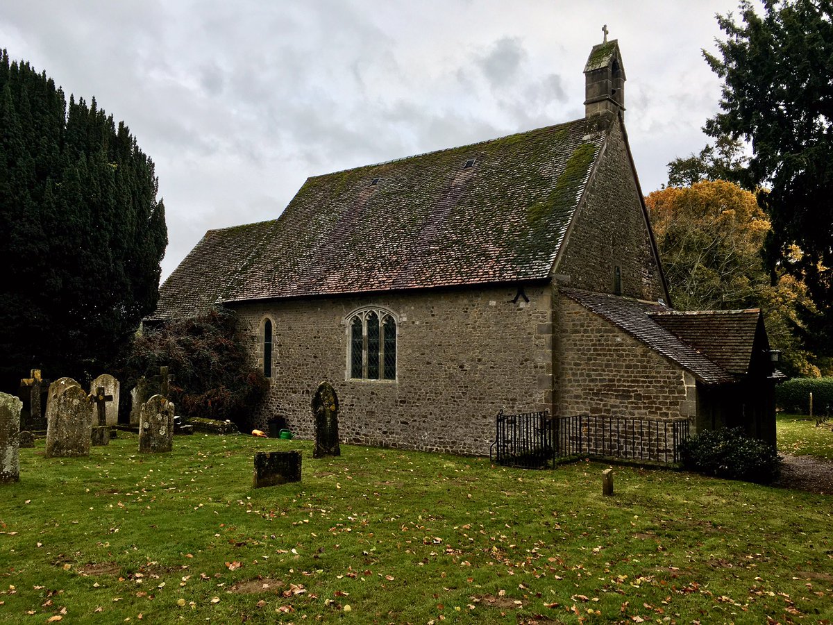 EngChurchPics's tweet photo. A line of pumpkins points the way to St Peter’s, #Terwick, West Sussex. Built within a century of the Norman conquest. There are 34 Chase family graves in the churchyard, including this one with the weeping willow and an urn. https://t.co/pXJDlqZZXo