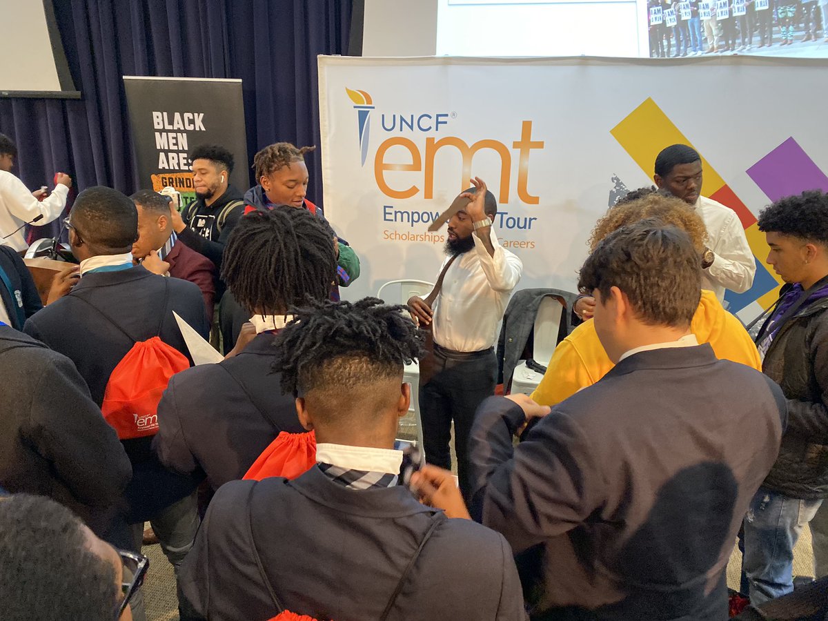 UNCF's tweet image. We have men teaching our youth how to tie a tie and prepare themselves for the future! #GuyTalk #TiedToGreatness #EmpowerMeTour
