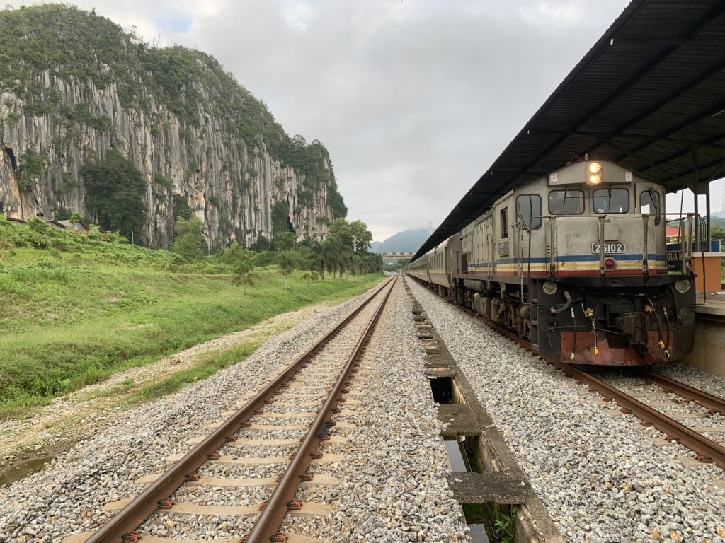 We arrived early at the beautiful station of Gua Musang due to the faster run. That gave me opportunity to take some photos of train and the limestone cliff together.