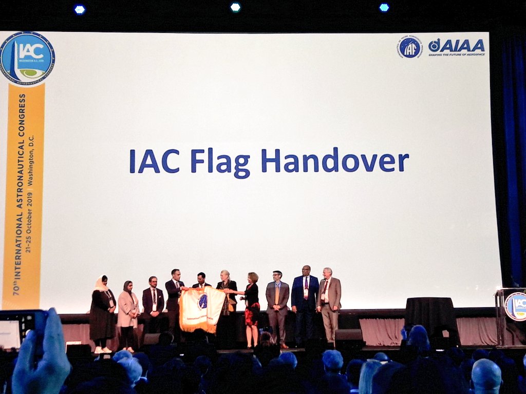 AimisRexus's tweet photo. The traditional Flag Handover to the next IAC-Host, the United Arab Emirates, marks the end of this extraordinary event! Thank you for following us through this week, it was a great experience! #RoadToRexus #spacestuff #wellbeback ~fs https://t.co/UjpXFoWL40
