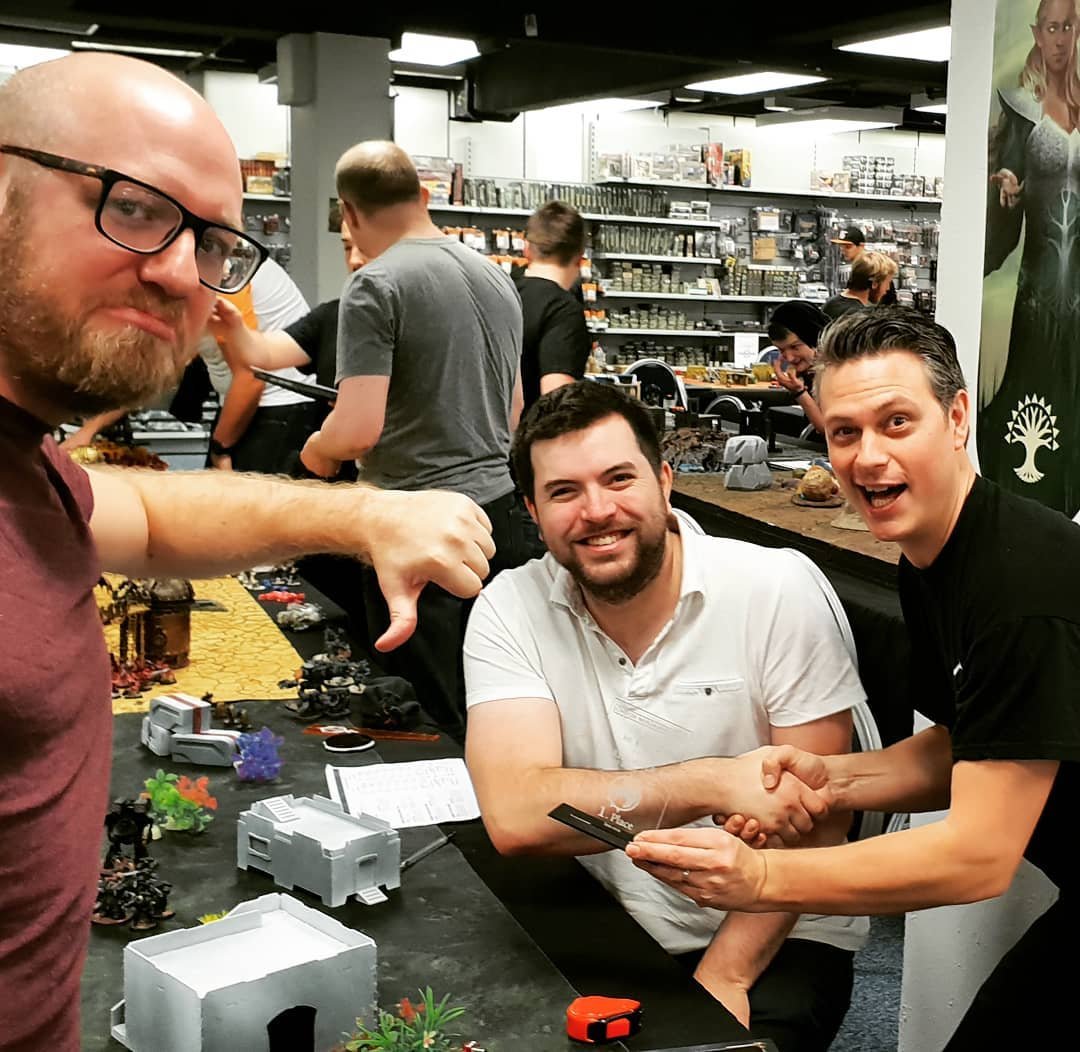 LondonWG's tweet photo. Fun times at the @lwarguild #funnfluff October 2019 - we're already handing out trophies! Simon Priddis collects his @badmooncafe GT Heat 2, 1st place trophy, and by pure chance, he's pitched against the same chap he faced in the final round of that tournament Jack Ship! 😅

#40k https://t.co/Cjggcubdu6