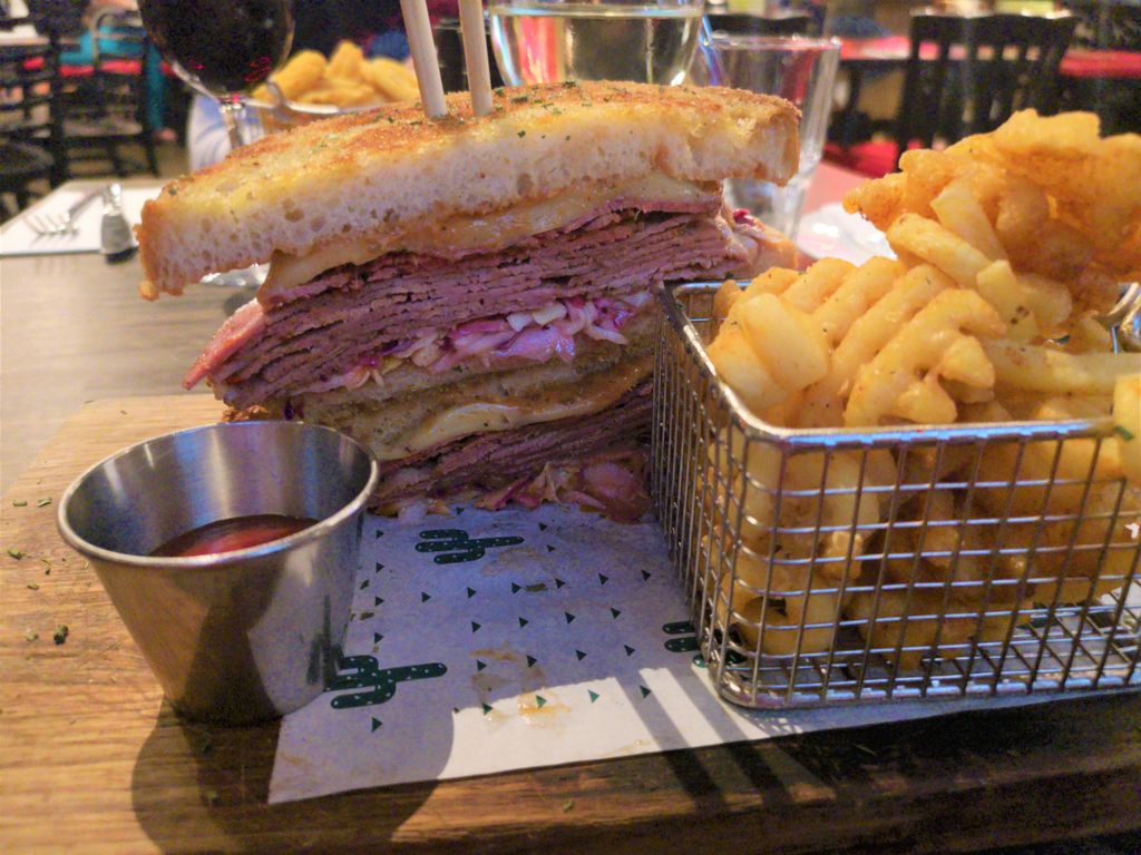 Boozy_Foodie's tweet photo. A visit to Guy Fieri Kitchen & Bar is exactly as you would expect - over-the-top, massive portions, a heart attack on a plate 😂 My Reuben sandwich was seriously delicious. I need to go back for the legendary Trash Can Nachos though! #SaturdayShenanigans #Doodeet #WhyIAmFat https://t.co/dKtb57s2GW
